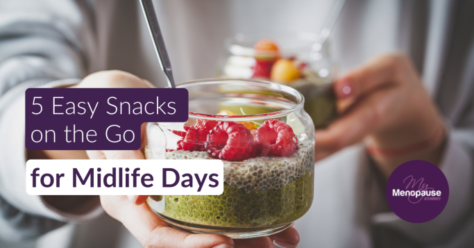Hand holding a glass jar of chia pudding topped with raspberries — protein snacks on the go for midlife women