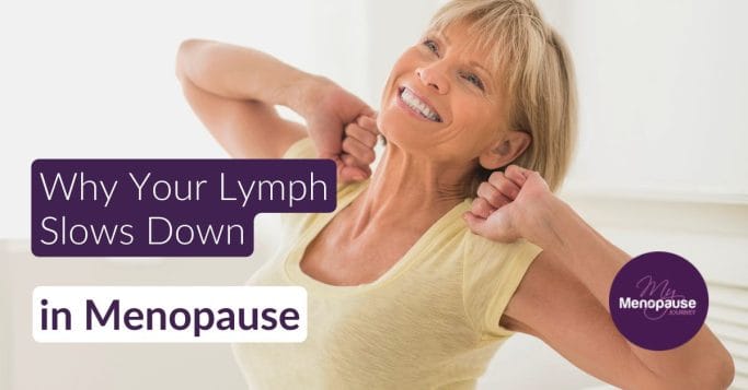 Midlife woman gently stretching by a sunlit kitchen window — supporting lymphatic system menopause flow
