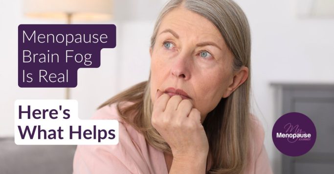Midlife woman pausing in her kitchen, thinking — menopause brain fog