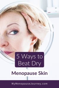 Midlife woman looking at her skin in a round mirror &mdash; 5 natural ways to beat dry menopause skin