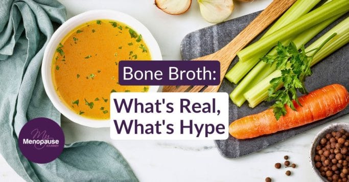 Midlife woman holding a warm mug of bone broth in her kitchen &mdash; bone broth benefits