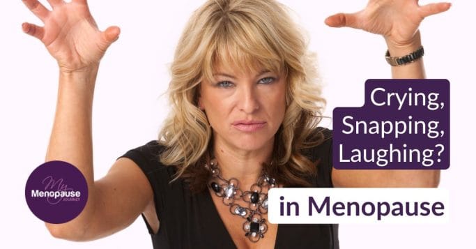Midlife woman with clawed hands and a fierce frown, caught mid mood swing
