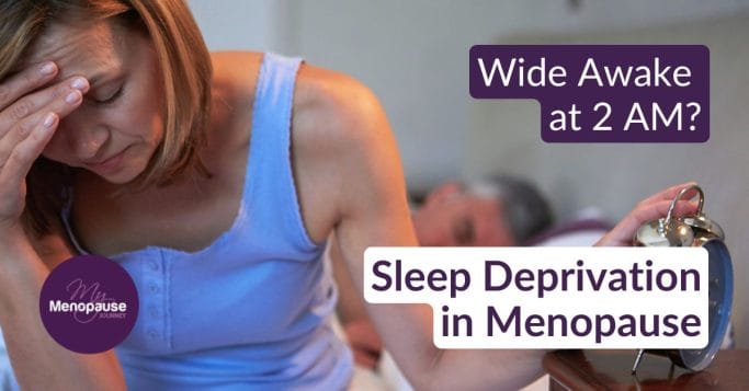 Midlife woman lying awake in bed at night, struggling with sleep deprivation in menopause