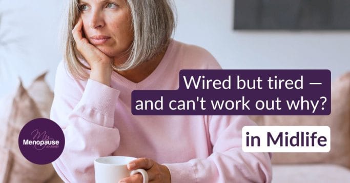 Tired midlife woman with coffee at the kitchen table — adrenal fatigue and stress in menopause