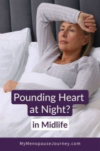 Woman in her fifties breathing slowly to calm a racing heart at night