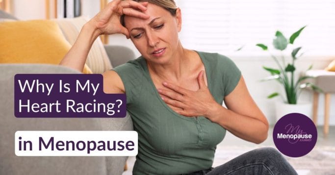Midlife woman resting a hand on her chest, noticing heart palpitations in menopause