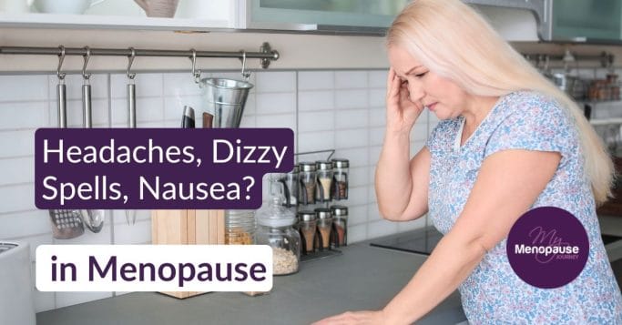 Midlife woman leaning on her kitchen counter, hand to her temple — menopause headaches