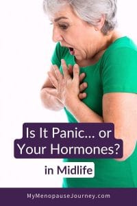 panic-attack-blog Panic attacks in menopause: startled midlife woman in a green top clutching her chest