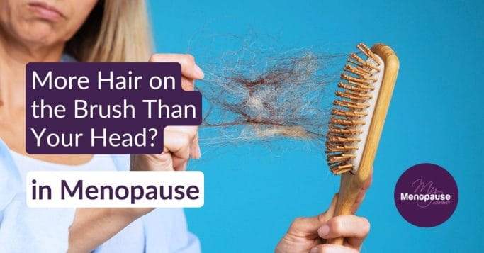 Midlife woman checking her thinning hair in the mirror — menopause hair loss